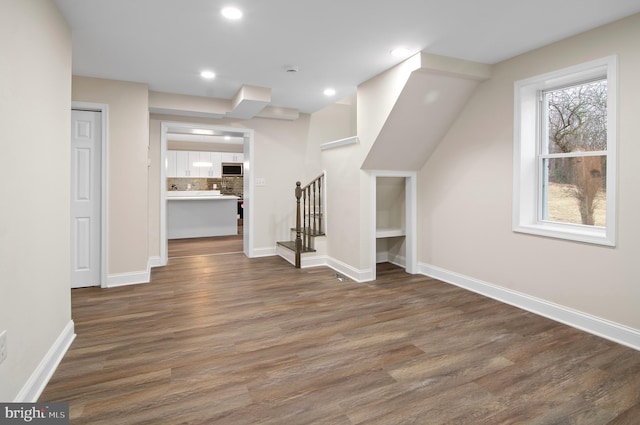 bonus room featuring dark hardwood / wood-style floors