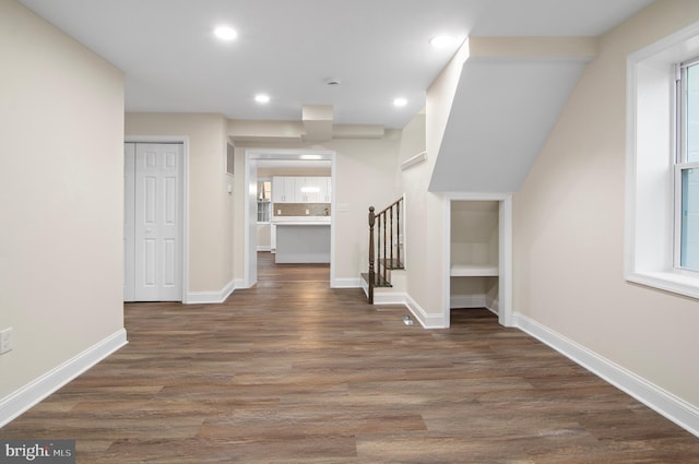 hall with dark hardwood / wood-style flooring