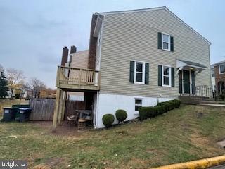 rear view of house featuring a yard