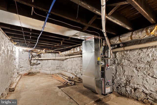 basement featuring heating unit