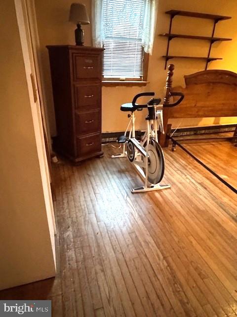 exercise area with wood finished floors