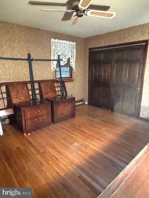 bedroom featuring dark wood finished floors