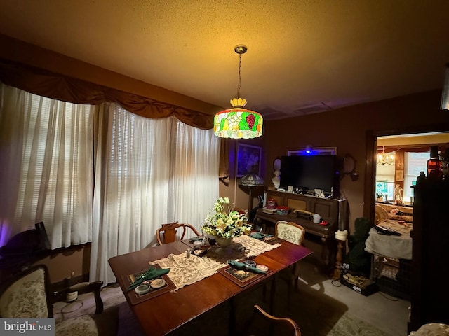 dining room featuring lofted ceiling