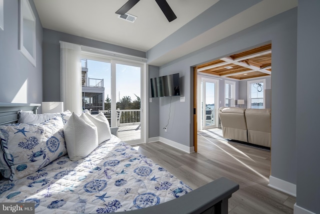 bedroom with coffered ceiling, light hardwood / wood-style floors, beam ceiling, ceiling fan, and access to exterior