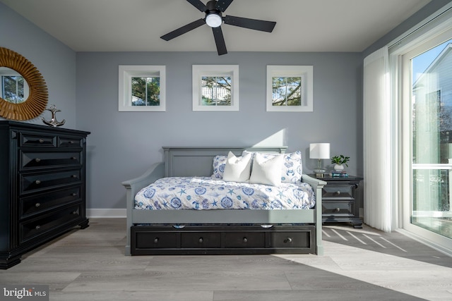 bedroom featuring ceiling fan and light hardwood / wood-style floors