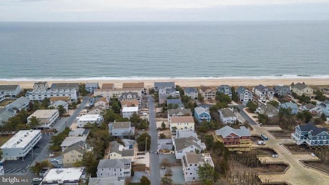 bird's eye view featuring a beach view and a water view