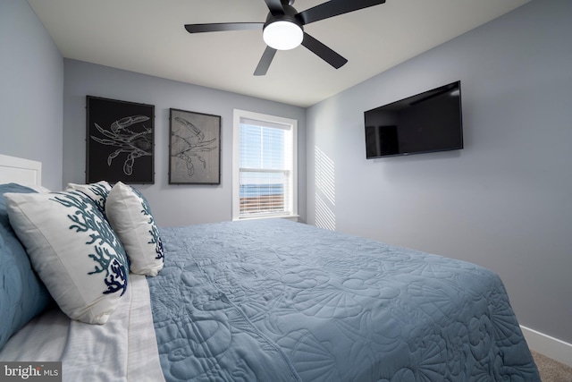 bedroom with ceiling fan and carpet