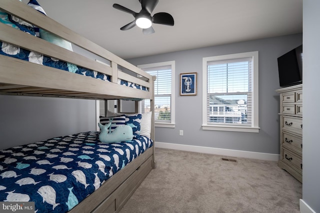 bedroom with light colored carpet and ceiling fan