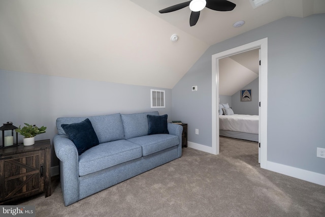 living room with ceiling fan, light colored carpet, and vaulted ceiling