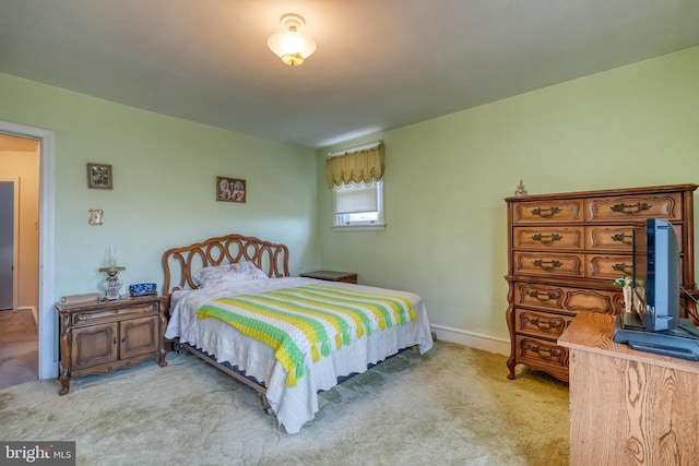 bedroom with light carpet