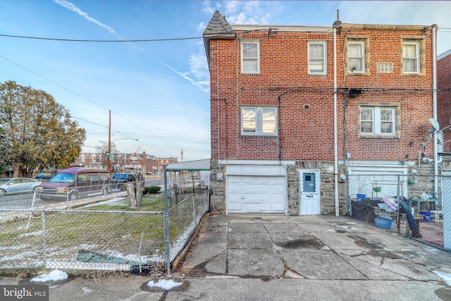 back of house with a garage