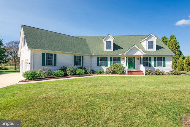 cape cod home featuring a front lawn