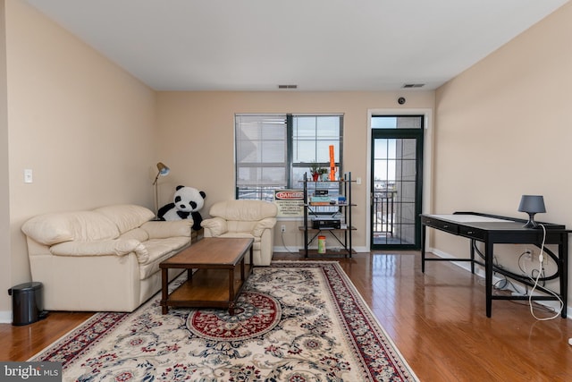 living room with wood-type flooring