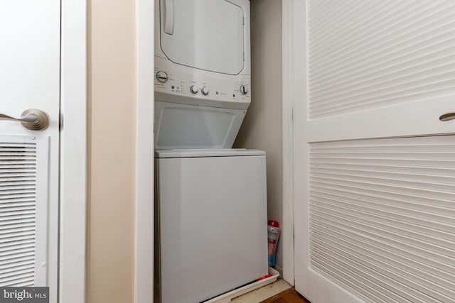 laundry area featuring stacked washing maching and dryer