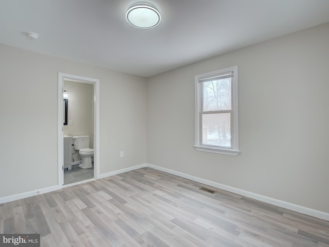 unfurnished room featuring light hardwood / wood-style floors