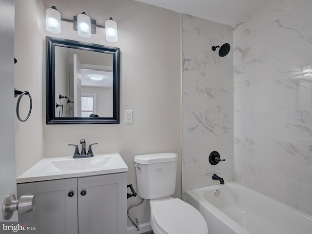 full bathroom with vanity, tiled shower / bath, and toilet