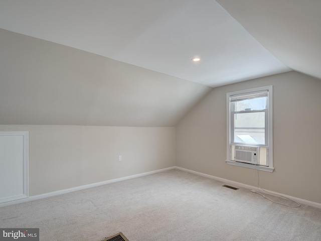 bonus room with vaulted ceiling, carpet floors, and cooling unit