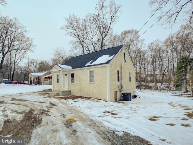 bungalow-style home featuring central air condition unit