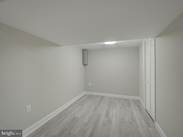 basement featuring light hardwood / wood-style floors