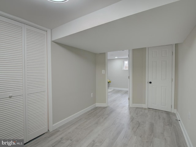 basement featuring light hardwood / wood-style floors