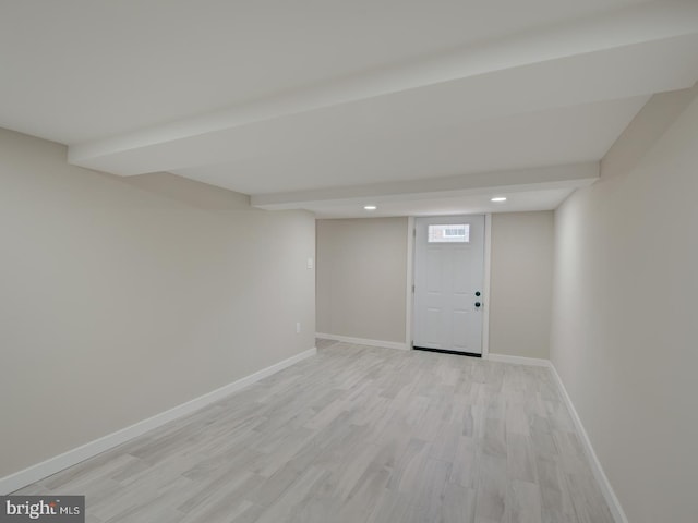 basement featuring light hardwood / wood-style flooring