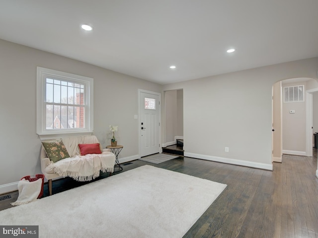 sitting room with dark wood-type flooring