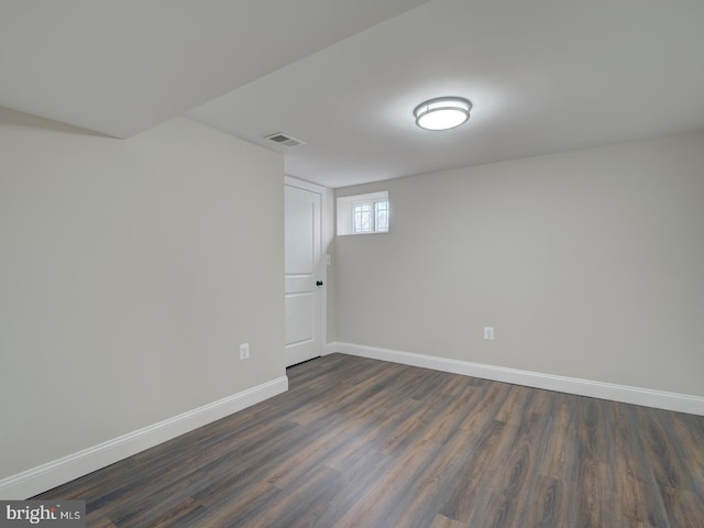 basement featuring dark wood-type flooring