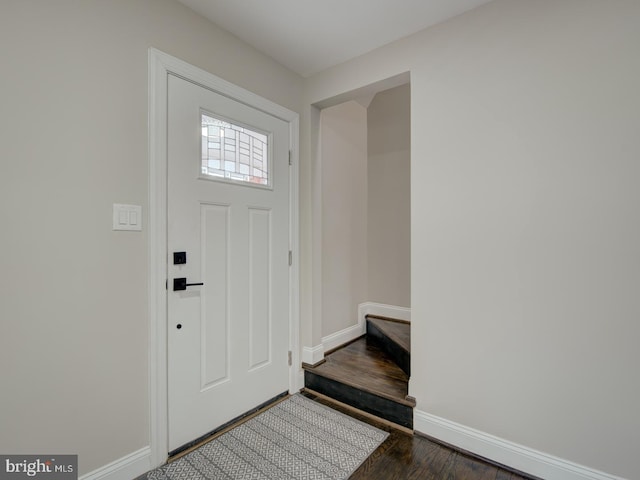 entrance foyer featuring dark hardwood / wood-style floors