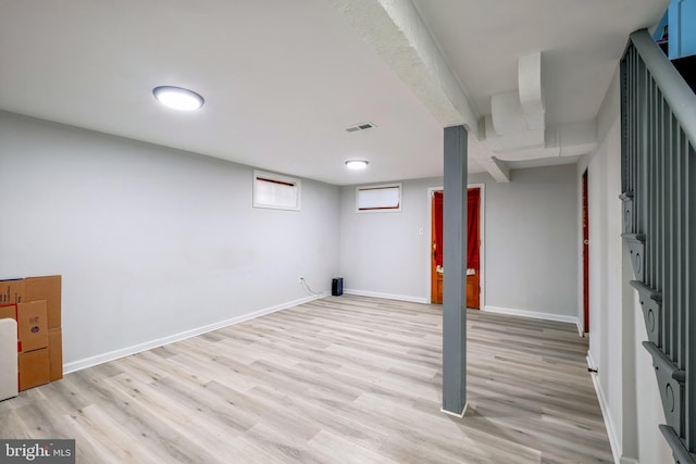 basement featuring light hardwood / wood-style flooring