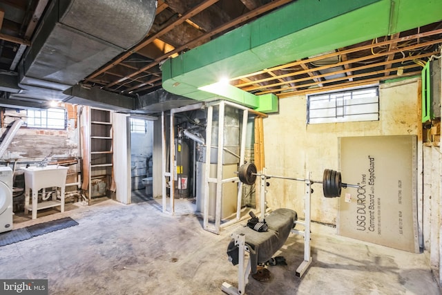 basement with washer / dryer and water heater