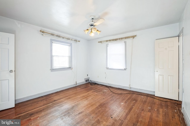 unfurnished bedroom featuring ceiling fan and hardwood / wood-style flooring