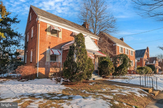 view of snow covered property