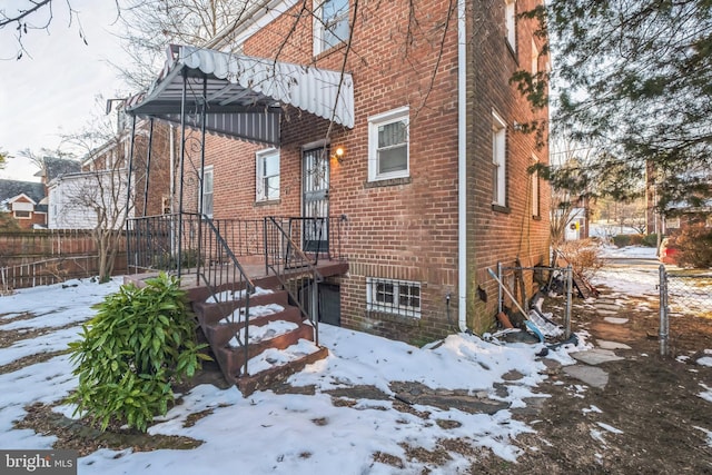 view of snow covered house