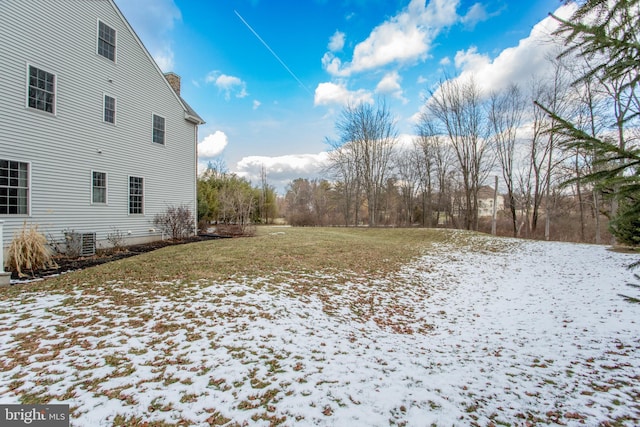 yard covered in snow with central AC unit