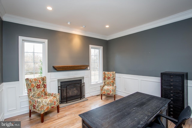 interior space featuring crown molding and light hardwood / wood-style floors