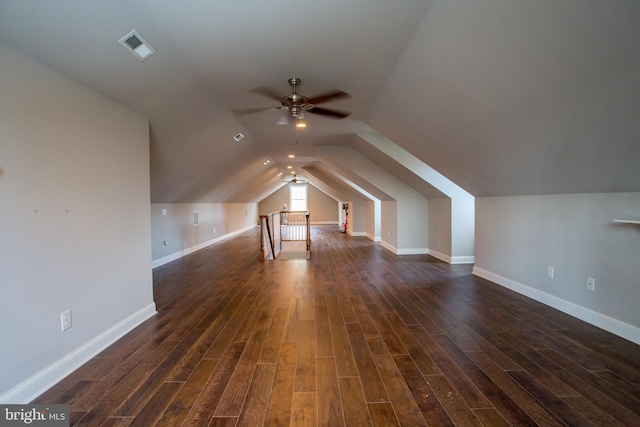 bonus room with ceiling fan, vaulted ceiling, and dark hardwood / wood-style flooring