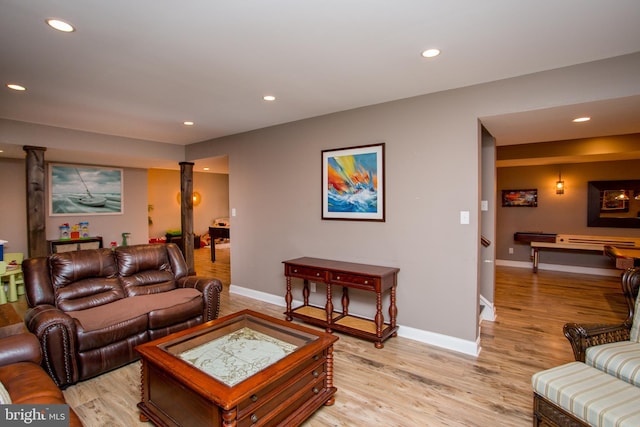 living room with light hardwood / wood-style flooring