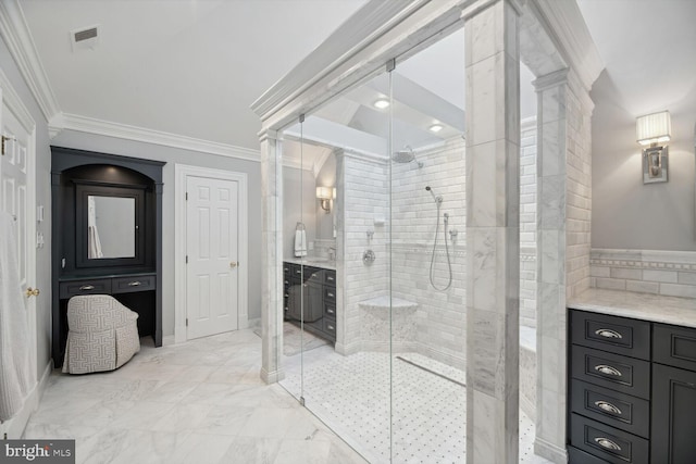 bathroom with an enclosed shower, vanity, and crown molding