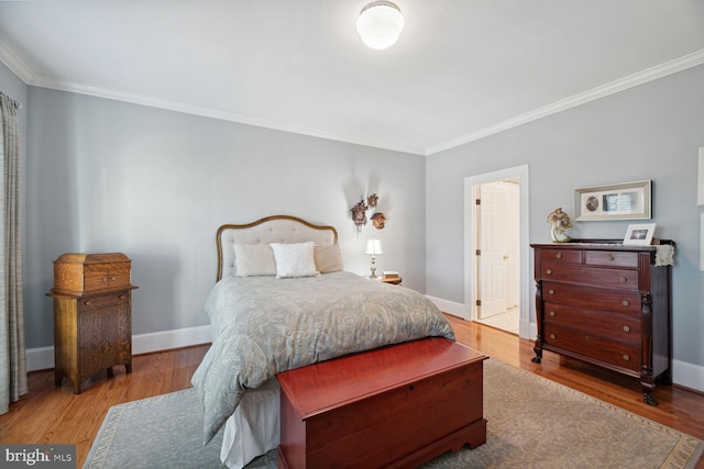 bedroom featuring crown molding and hardwood / wood-style flooring