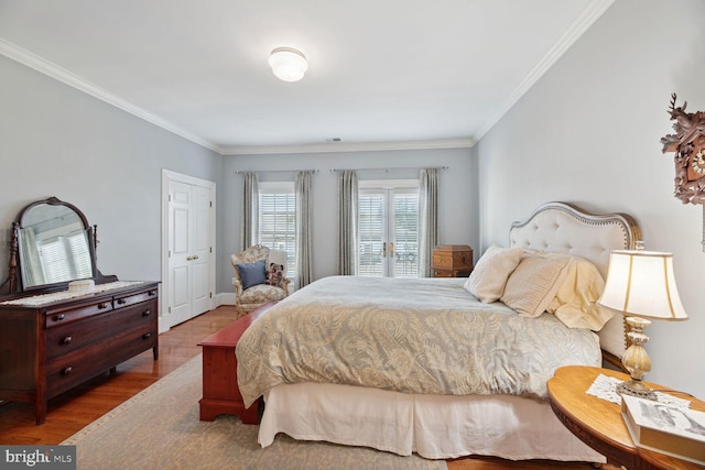 bedroom featuring crown molding and hardwood / wood-style floors