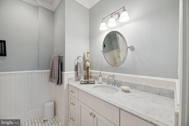 bathroom featuring crown molding and vanity