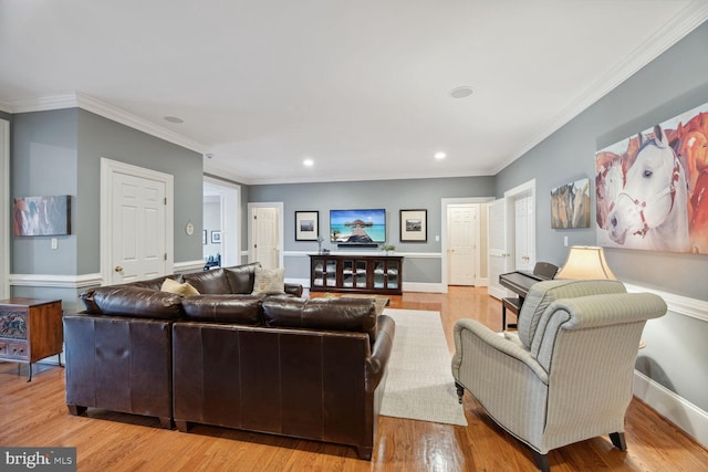 living room with light hardwood / wood-style flooring and ornamental molding