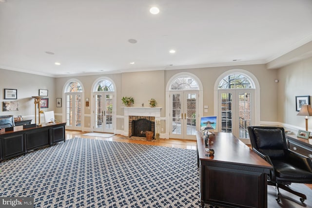 home office with crown molding, french doors, and a healthy amount of sunlight