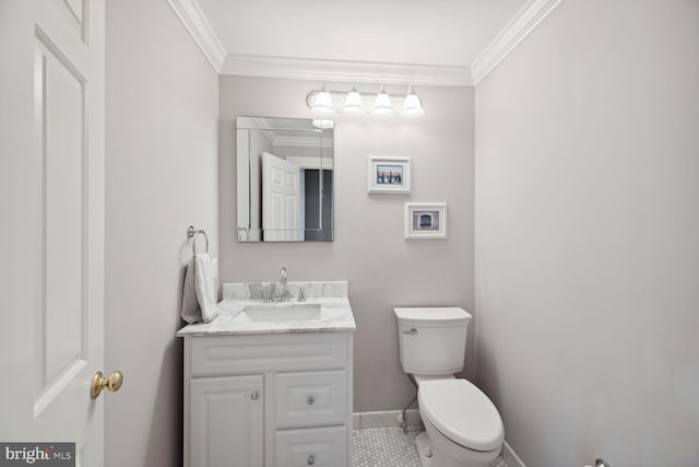 bathroom with crown molding, vanity, and toilet