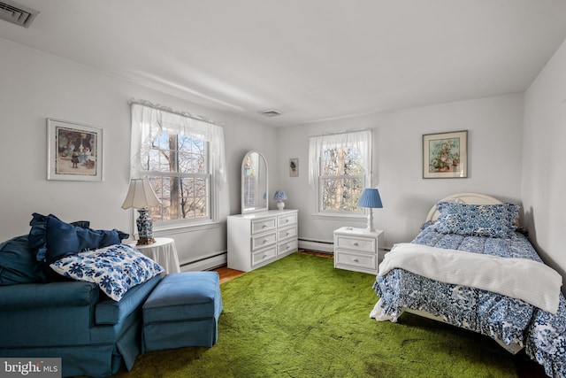 bedroom featuring a baseboard radiator and visible vents