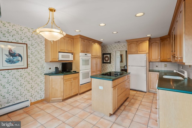 kitchen with a baseboard heating unit, white appliances, dark countertops, and wallpapered walls