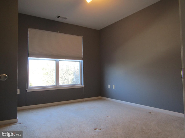 unfurnished room featuring carpet flooring