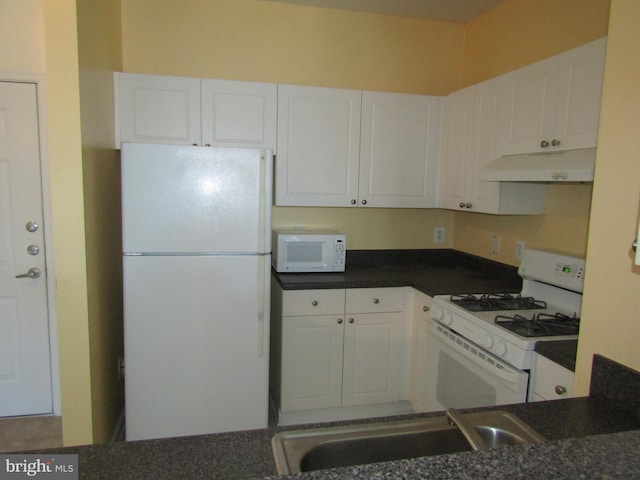 kitchen with sink, white appliances, and white cabinets