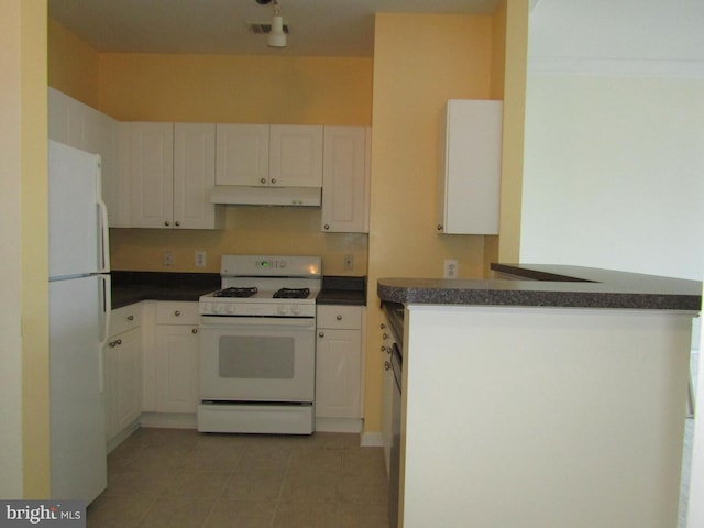 kitchen featuring kitchen peninsula, white cabinets, and white appliances