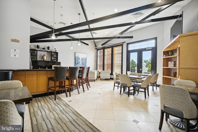 dining area with french doors, visible vents, beamed ceiling, and light tile patterned flooring